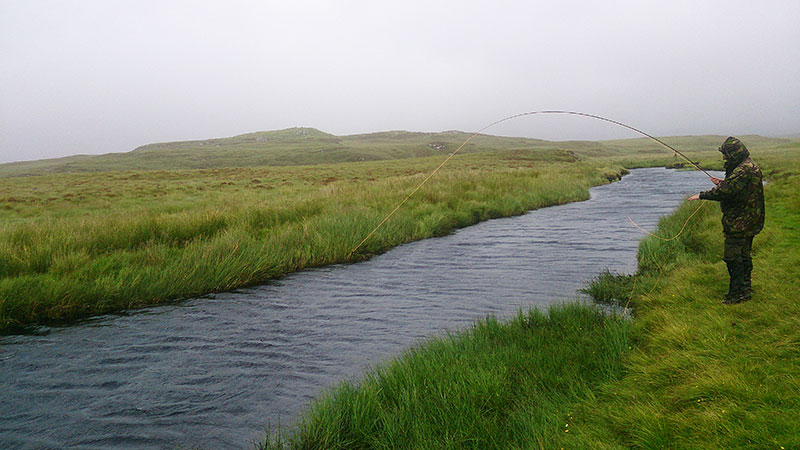 Playing a salmon close to Dollag's Cottage